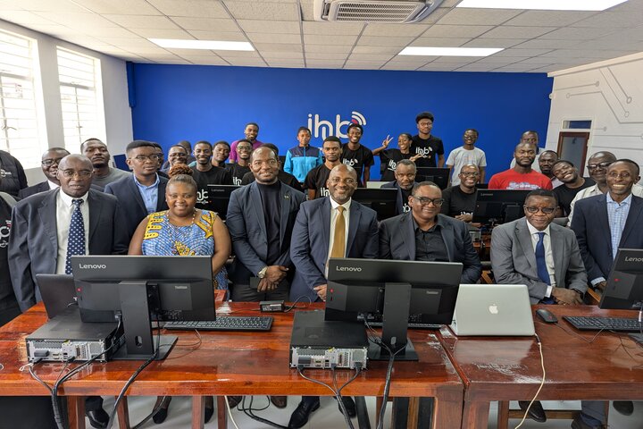 VC and Infratel team pose for a photo in  a renovated lecture room at computer science department